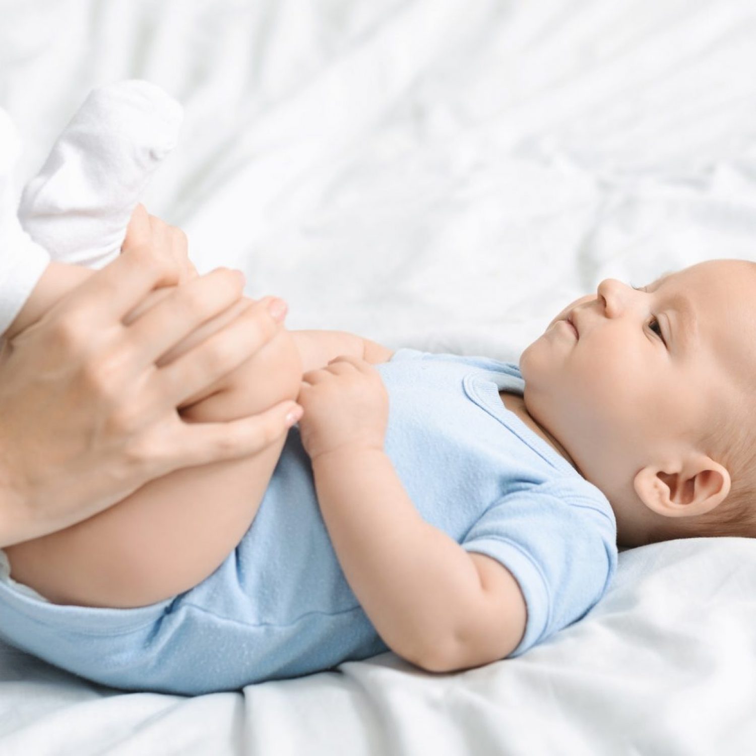 mom-doing-gymnastics-with-her-newborn-child-to-relieve-constipation.jpg