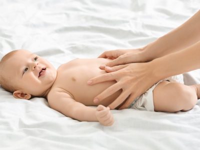 mother-massaging-tummy-of-newborn-baby-to-prevent-colics.jpg